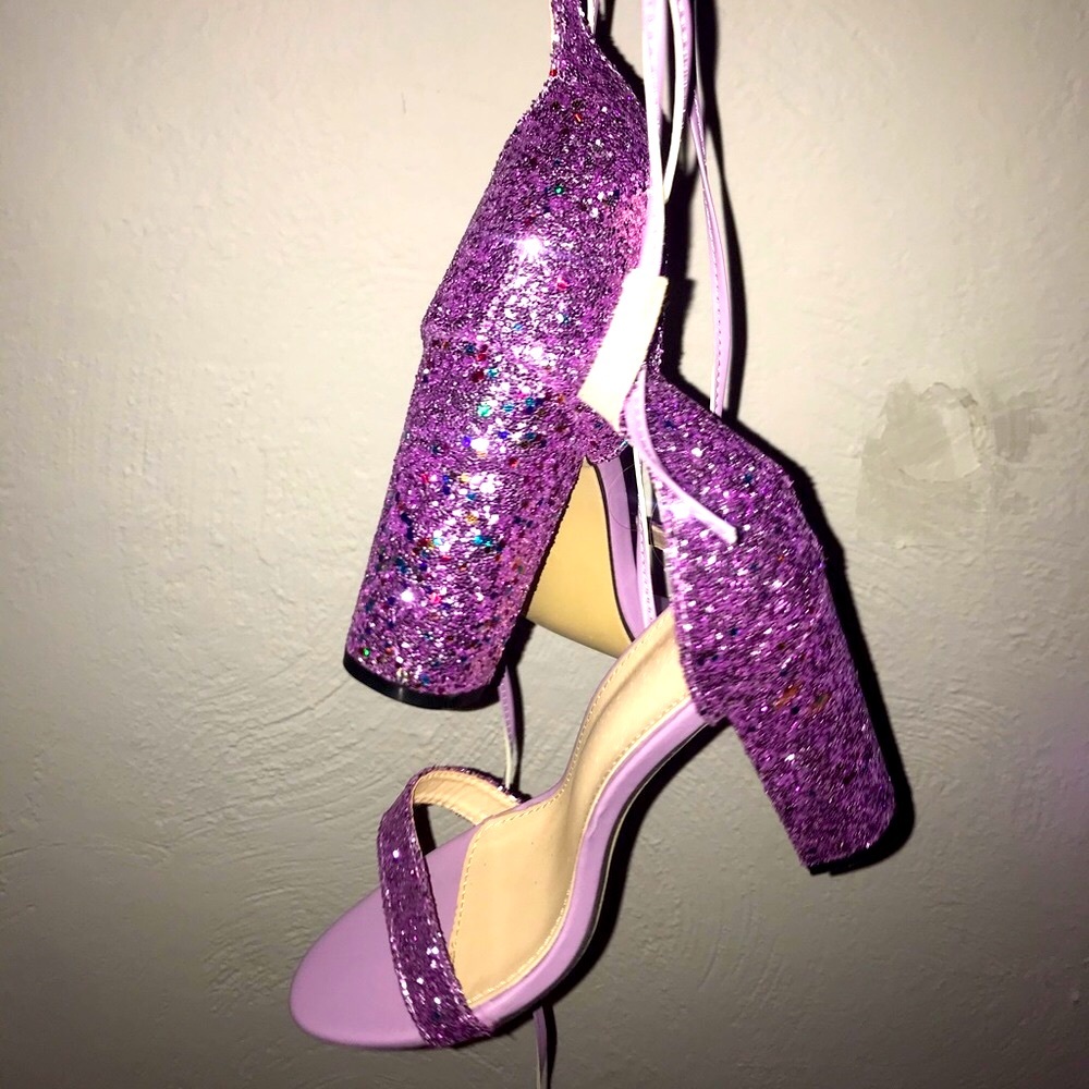 Strappy, purple glitter open toed heels.